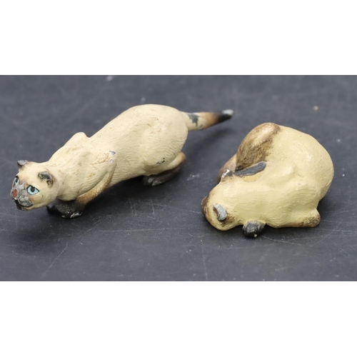 798 - 2 small painted bronze figures of cats, largest 7cm long. (2)