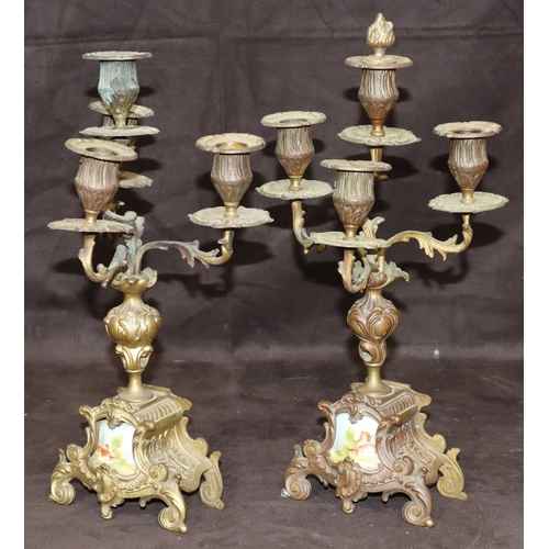 804 - A pair of spelter 4-light candelabras with turned stems on splayed bases inset with china panels, 35... 