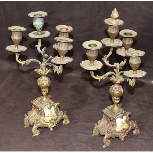 804 - A pair of spelter 4-light candelabras with turned stems on splayed bases inset with china panels, 35... 