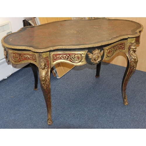 815 - A 19th Century Boulle scallop shaped writing table with allover raised figurehead, leaf and scroll d... 