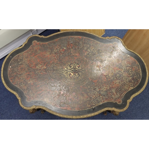 815 - A 19th Century Boulle scallop shaped writing table with allover raised figurehead, leaf and scroll d... 