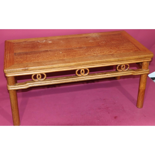 816 - A good quality reproduction Oriental rectangular shaped coffee table with entwined circle fringe, on... 