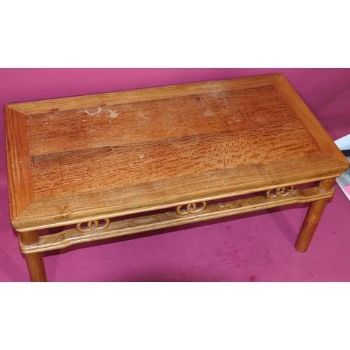 816 - A good quality reproduction Oriental rectangular shaped coffee table with entwined circle fringe, on... 