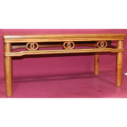 816 - A good quality reproduction Oriental rectangular shaped coffee table with entwined circle fringe, on... 