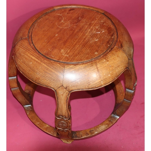 817 - An Oriental hardwood circular bulbous shaped coffee table on 4 shaped supports with further circular... 