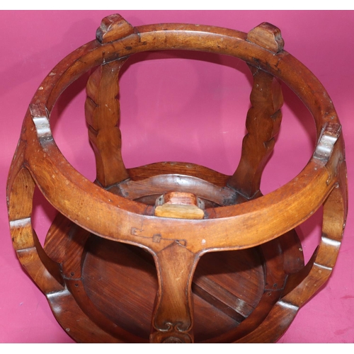 817 - An Oriental hardwood circular bulbous shaped coffee table on 4 shaped supports with further circular... 