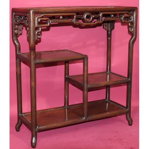 822 - An Oriental hardwood rectangular shaped stand with pierced frieze, 2 under tiers, on round splayed l... 