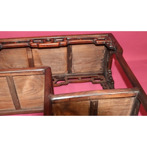 822 - An Oriental hardwood rectangular shaped stand with pierced frieze, 2 under tiers, on round splayed l... 