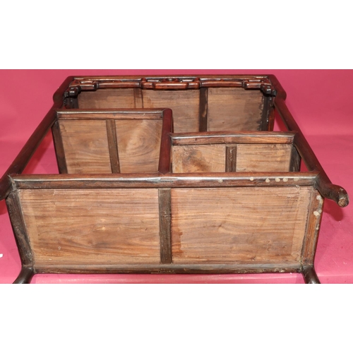 822 - An Oriental hardwood rectangular shaped stand with pierced frieze, 2 under tiers, on round splayed l... 