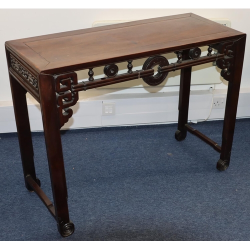 824 - A good quality Chinese hardwood alter table with carved and turned frieze and carved and scroll deco... 