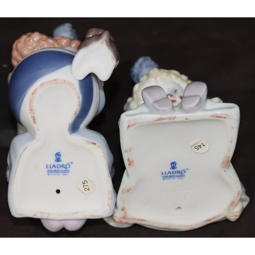 86 - A pair of Lladro figures of seated clown, children with puppies, largest 12cm high