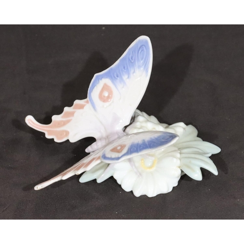 92 - A Lladro figure of a butterfly perched on a flower, 13cm wide, 8cm high