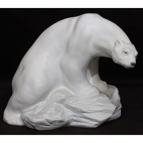 96 - A Lladro large figure of a polar bear seated on a rock, numbered 8481, 21cm high