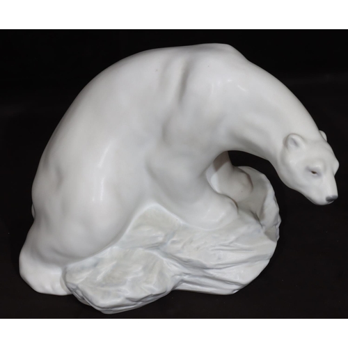 96 - A Lladro large figure of a polar bear seated on a rock, numbered 8481, 21cm high