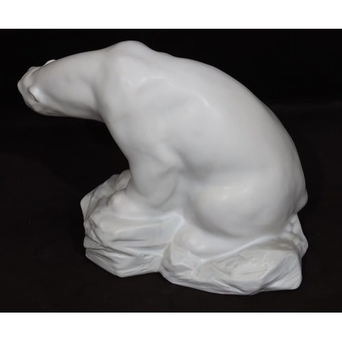 96 - A Lladro large figure of a polar bear seated on a rock, numbered 8481, 21cm high