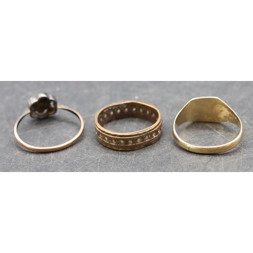 487 - A 9ct gold signet ring, size M/N, 1.5 grams, a 9ct gold eternity ring set with clear stones and a 9c... 