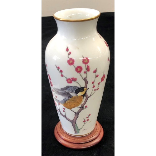 7005 - A Franklin Porcelain The Heralds of Spring vase, 30cm high with certificate of authenticity and wood... 