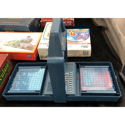 7011 - A VTech Electronic Talking Battleship Command Game, a Scrabble De Luxe with built in turntable, an I... 