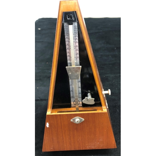 7022 - A traditional metronome, System Maelzel, Germany, boxed, a 19cm diameter tambourine, boxed, and a pa... 