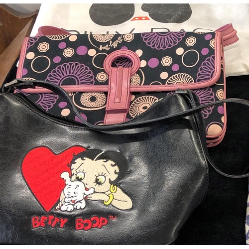 7024 - A Billy Bag of London bag with protective cover, a Betty Boop  bag, a zipped cosmetic case, a Lola R... 