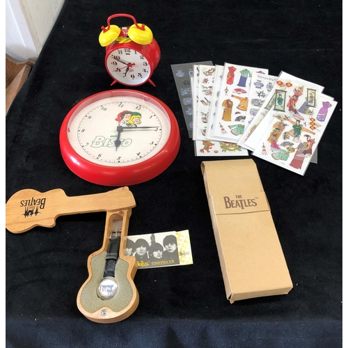 7025 - A Beatles watch (winder missing) in wood guitar case and 1197 guarantee card, a red and yellow wind ... 