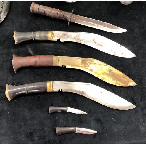 7031 - 3 Khukuri knives with 2 leather sheaths, 1 with 2 small penknives and 1 other knife stamped Japan wi... 