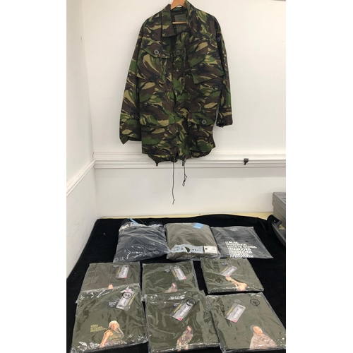 7040 - A navy crew neck combat jumper size M and an olive crew neck combat jumper size M, a woodland field ... 