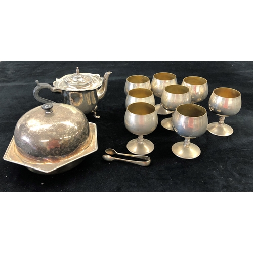 7051 - A silver plated muffin dish, teapot (handle loose), 8 goblets and a pair of sugar nips.