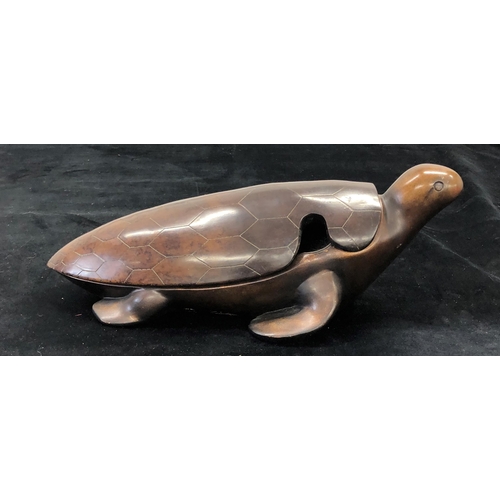 7067 - A heavy based composition turtle with lift off shell, stamped to side, 44cm long overall.