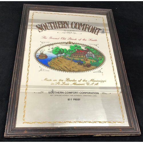 7073 - A Southern Comfort advertising mirror in wood frame 54.5 x 89cm.