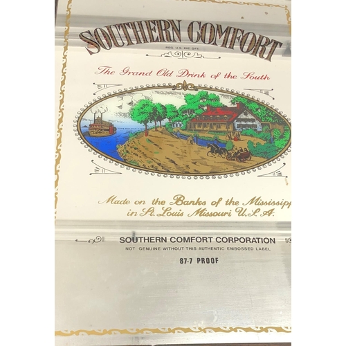 7073 - A Southern Comfort advertising mirror in wood frame 54.5 x 89cm.