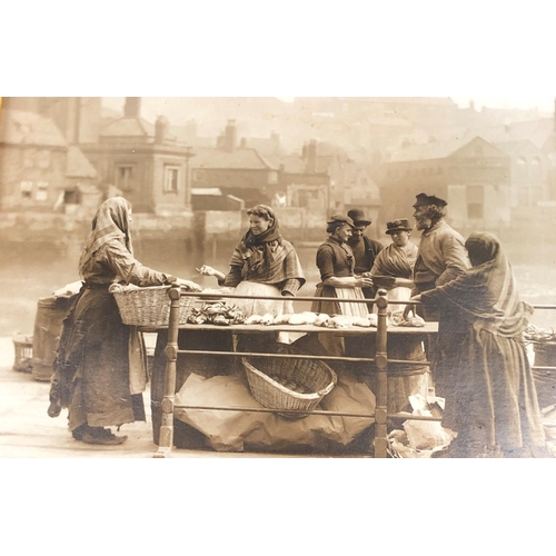 7076 - A print of a church, 25.5 x 32cm in wood frame and a sepia print of people by a market stall, 26 x 1... 