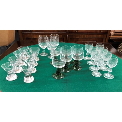 7099 - 8 modern heavy based small glasses, 8cm high, 6 modern small wine glasses with green bases and twist... 