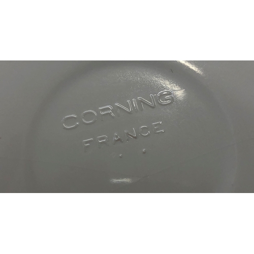 7101 - A set of 3 Corning France, graduated white saucepans