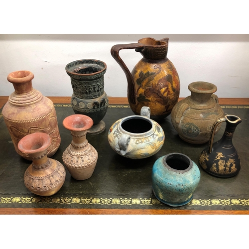 7103 - Various earthenware jugs, tallest 23xm high.