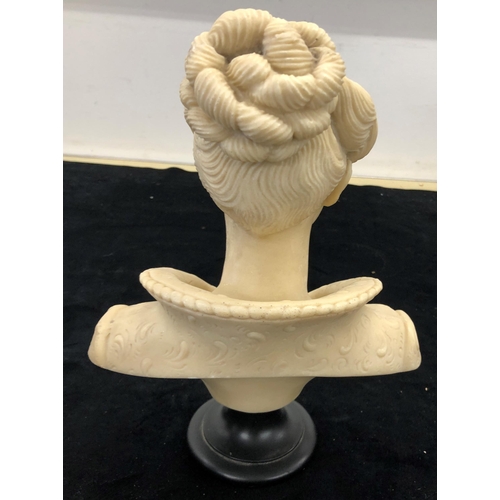 7109 - A composition bust of a lady, 32cm high.