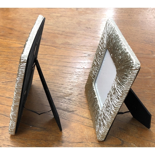 7137 - A pair of silver coloured photograph frames, 17 x 17cm by Rachel Zoe and a wood wall hanging spice b... 