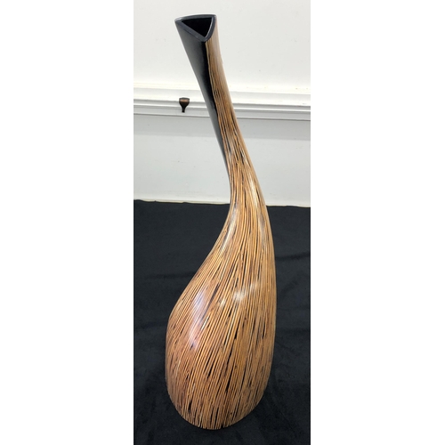 7139 - A modern wood curved vase, 74cm high.