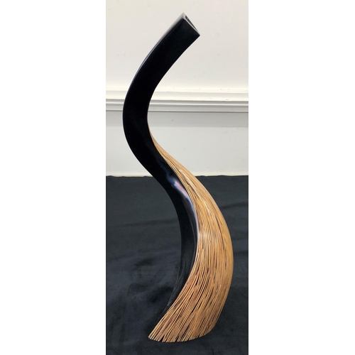 7139 - A modern wood curved vase, 74cm high.