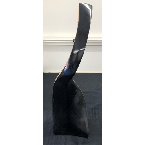 7139 - A modern wood curved vase, 74cm high.