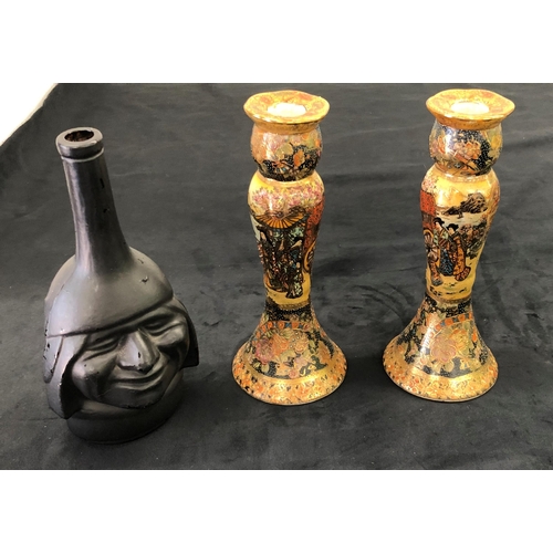 7141 - A pair of reproduction multi-coloured candlesticks stamped Satsuma to base, 26cm high and a blackene... 