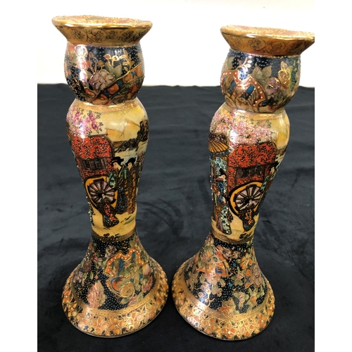 7141 - A pair of reproduction multi-coloured candlesticks stamped Satsuma to base, 26cm high and a blackene... 