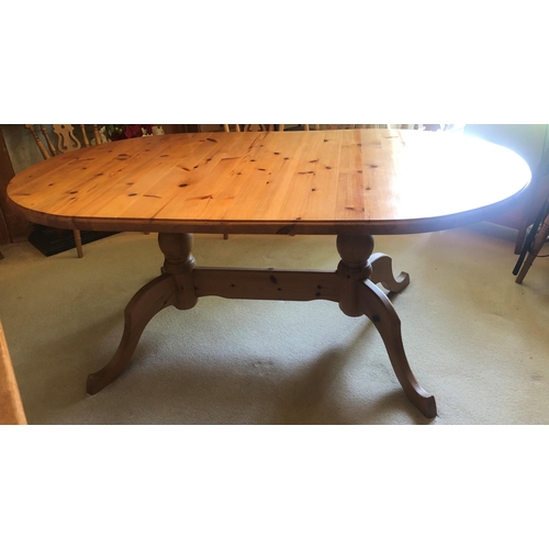 7167 - An oval topped D-end pine dining table, 82cm wide, 108cm deep, 75cm high. (Top single piece and scre... 