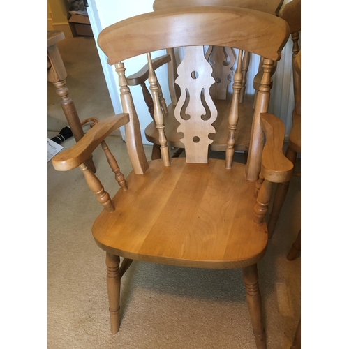 7168 - A set of 6 pine dining chairs, 2 carvers and 4 singles, carvers, 53.5cm wide overall. This item is n... 