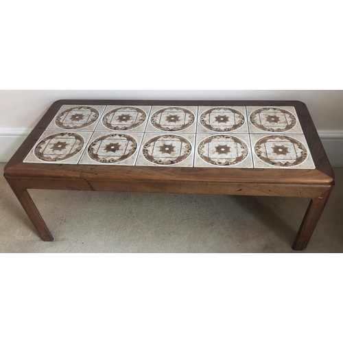 7174 - A vintage rectangular coffee table with tiled top, 112cm wide, 51cm deep, 39cm high. (Some water mar... 