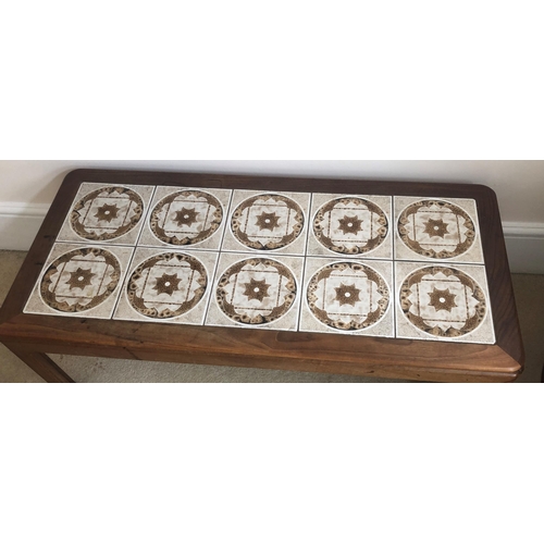 7174 - A vintage rectangular coffee table with tiled top, 112cm wide, 51cm deep, 39cm high. (Some water mar... 