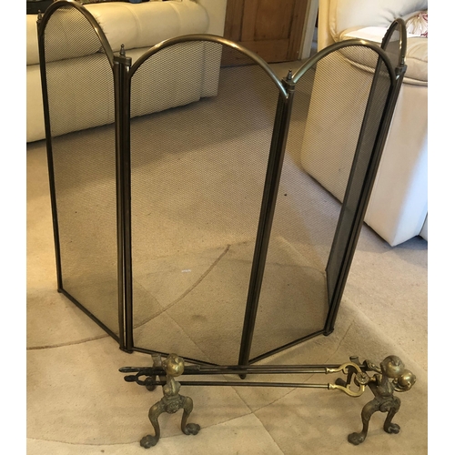 7185 - A 4-sectioned brass fire guard, 81cm high, 130cm wide open and a pair of brass fire dogs with ball a... 