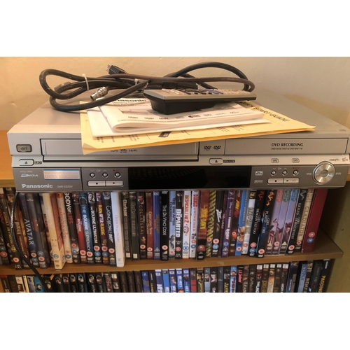 7186 - A Panasonic DVD player, model DMR-ES30V with remote control and manual and a bookshelf containing  a... 