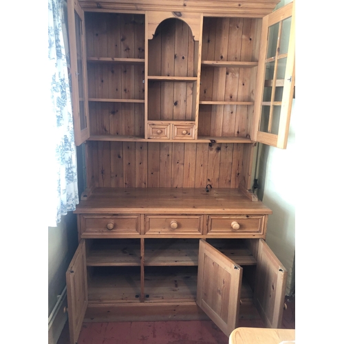 7194 - A good quality pine dresser with 2 upper glazed doors, central open shelf, 2 small drawers below, 3 ... 