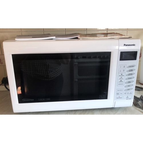 7198 - A Panasonic microwave oven, model NN-CT555W, serial no. 5C76051282 with manual and recipe book, 51cm... 